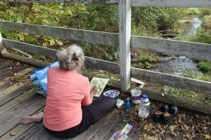 Plein air painting the creek