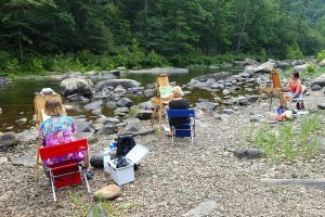 Plein air painting by the water